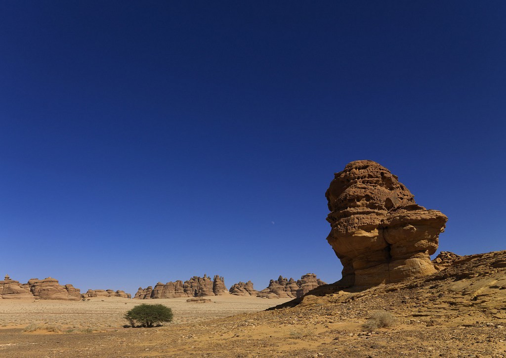 Madain Saleh in Saudi Arabia, a sister city to Jordan’s Petra. UNESCO world heritage site, located in the Al-Ula sector, within the Al Madinah Region of Saudi Arabia. The Archaeological Site of Al-Hijr (Madain Salih) was formerly known as Hegra, it is the largest conserved site of the civilization of the Nabataeans south of Petra in Jordan. It features well-preserved monumental tombs with decorated facades dating from the 1st century BC to the 1st century AD. With its 111 monumental tombs, 94 of which are decorated, and water wells, the site is an outstanding example of the Nabataeans' culture.