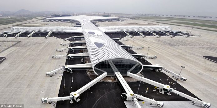 Shenzhen Opens Flashy New Airport Terminal architectural masterstroke and symbol of China's explosion onto the world stage of global travel.