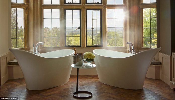 The Foxhill Manor Oak Suite features not, but two, free standing baths