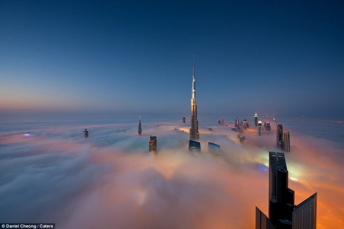 Mr Cheong's fog-engulfed shots appear to show some of the world’s tallest towers, including the Burj Khalifa, floating in the sky