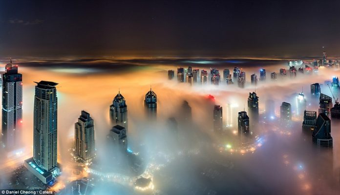 The 52-year-old photographer’s surreal work depicts the desert city from three different vantage points – the lowest being 73 floors high