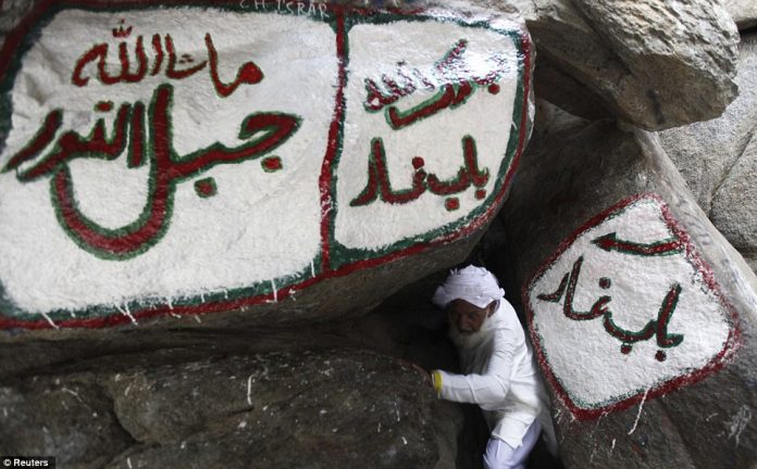 A Muslim pilgrim makes his way out of the Hira cave on Mount Noor. The hajj is one of the five pillars of Islam that every capable Muslim must perform at least once in lifetime