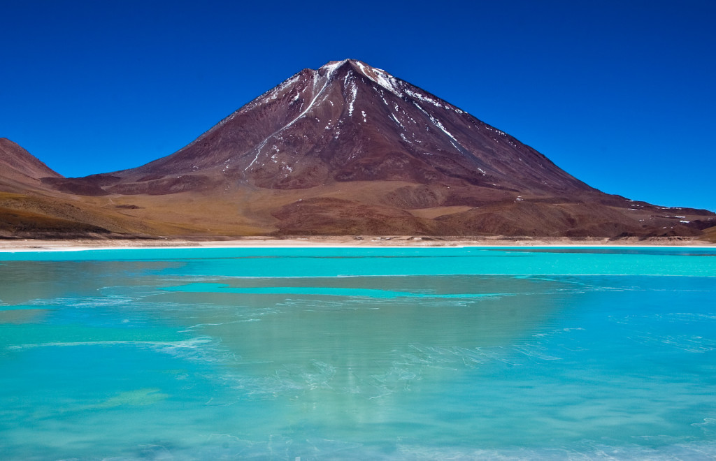 This is one of the most spectacular views that you will ever see. The Laguna Verde (Green Lagoon) is a salt lake in the southwest of the altiplano of Bolivia, on the Chilean border at the foot of the volcano Licancabur. Its colour is caused by sediments, containing copper minerals. It is elevated some 4,300 m (14,000 ft) above sea level.