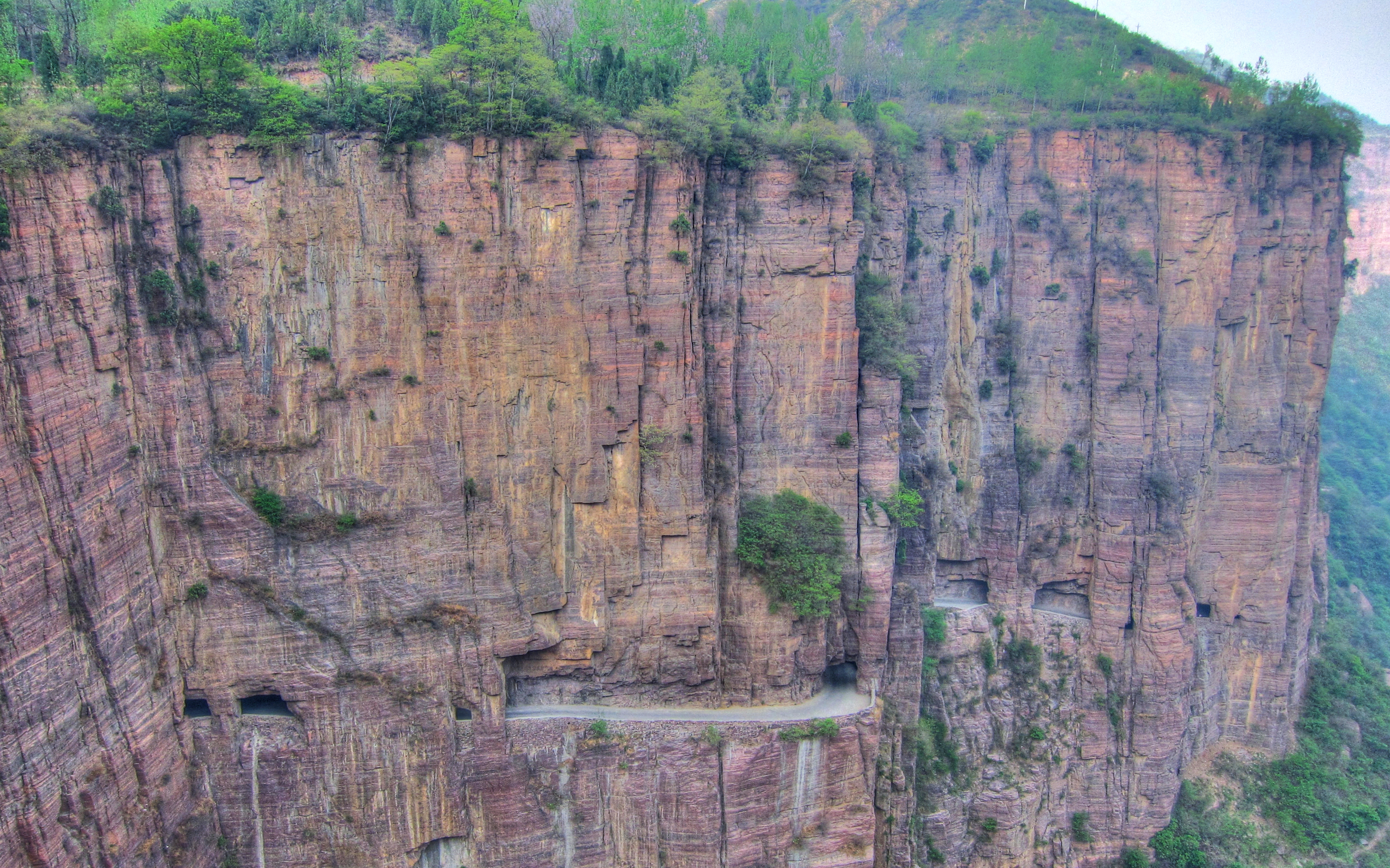 Therefore, the village is nestled in a valley surrounded by towering mountains cut off from outside civilization.