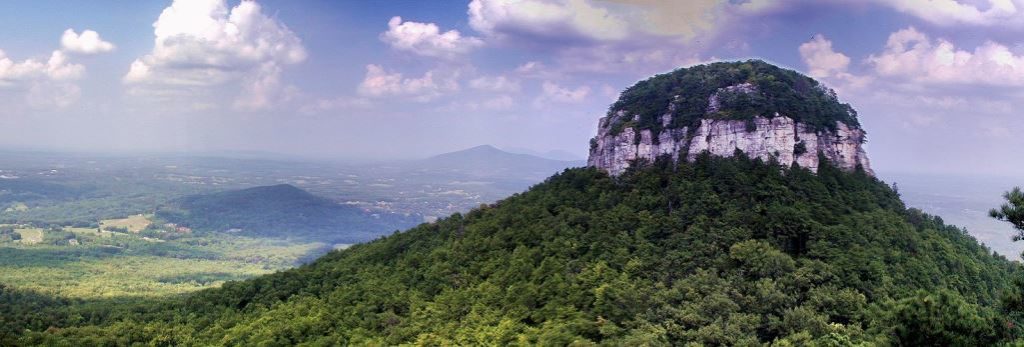 Pilot Mountain is part of Pilot Mountain State Park, stretching to the Yadkin River via a corridor of Land, and associated with adjacent Horne Creek Living Historical Farm.
