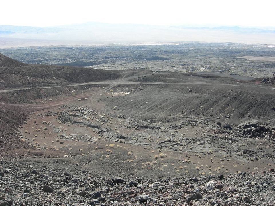 Therefore, the first eruption was a basaltic flow created extensive lava fields, and evidence of intrusive structures, it is believed the cinder cone was formed during this time. 