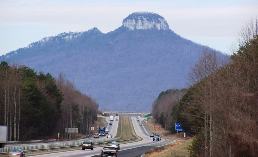 Pilot Mountain State Park is a popular destination for canoeing, fishing, horseback riding, picnicking, and rock climbing