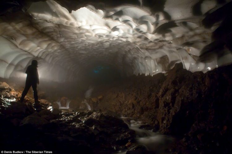 The cave has been carved out of the glacier by an underground river that is sourced in a hot spring gushing from the Mutnovsky volcano itself