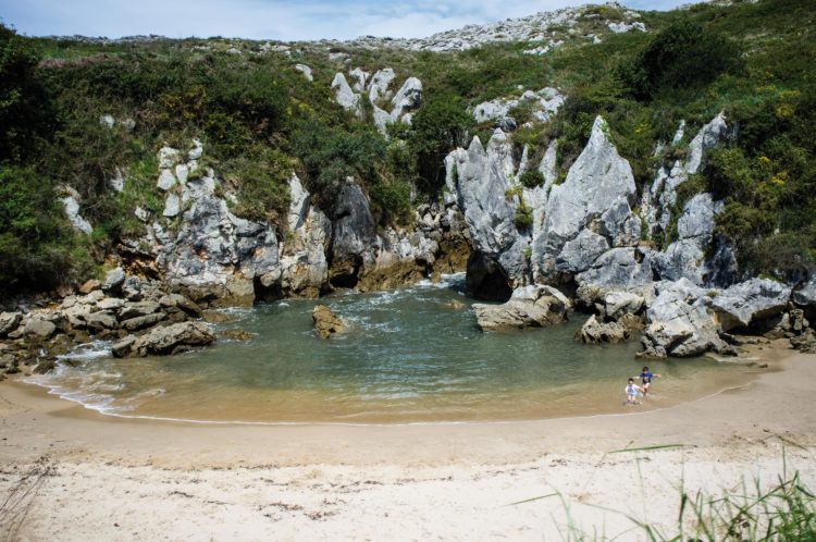 Playa de Gulpiyuri is one of the most astonishing beaches in the world, tucked away into a small inland hollow.