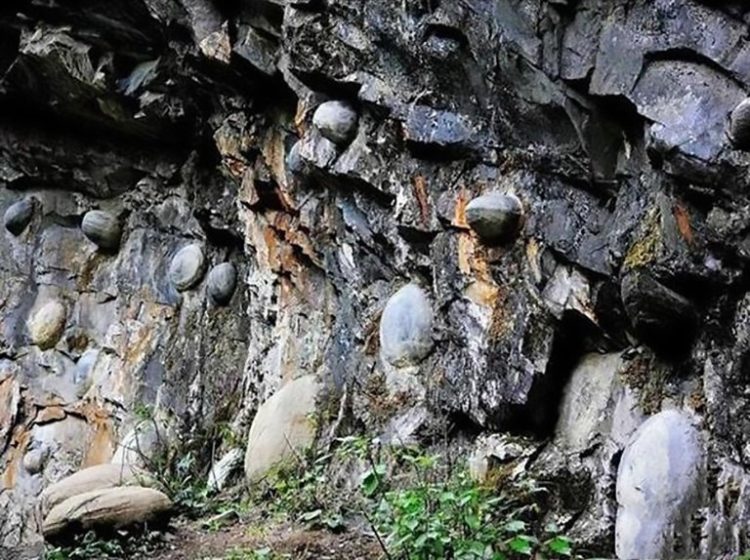 It has an uneven surface but every three decades it emits these odd-shaped rocks. The peoples of nearby village Gulu have been scratching there heads over several years as they keep finding impeccably smooth rocks.