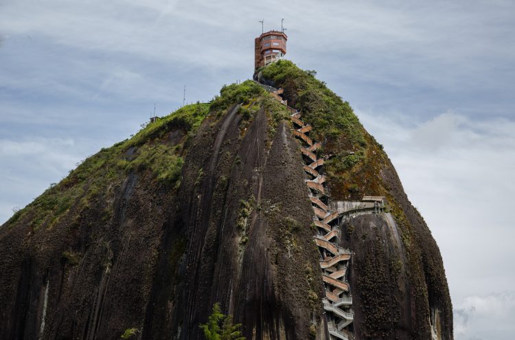 The Rock of Guatape, is an iconic landmark inselberg also famous as “The Stone of El Peñol” located in the border of two towns Guatapé, and El Peñol Antioquia in Colombia. The Rock of Guatape, is an iconic landmark inselberg also famous as “The Stone of El Peñol” located in the border of two towns Guatapé, and El Peñol Antioquia in Colombia.