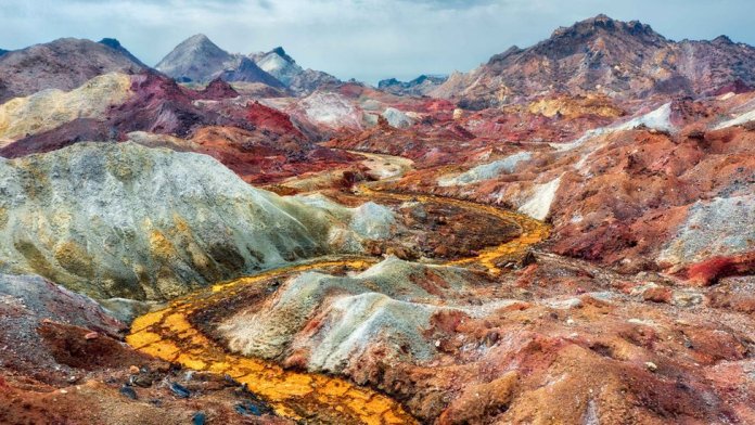 The temperature of Hormuz Island is very arid, and hot in summer with no vegetation or freshwater available.