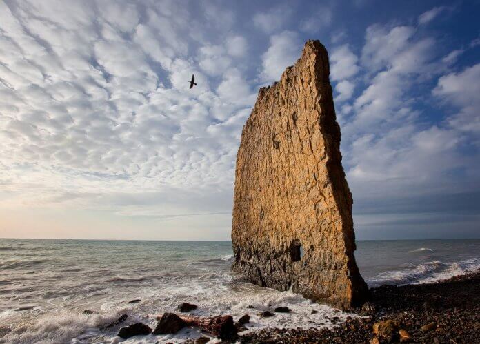 From distance, the perpendicular shape Sail Rock seems like a boat with a giant sail has come ashore.